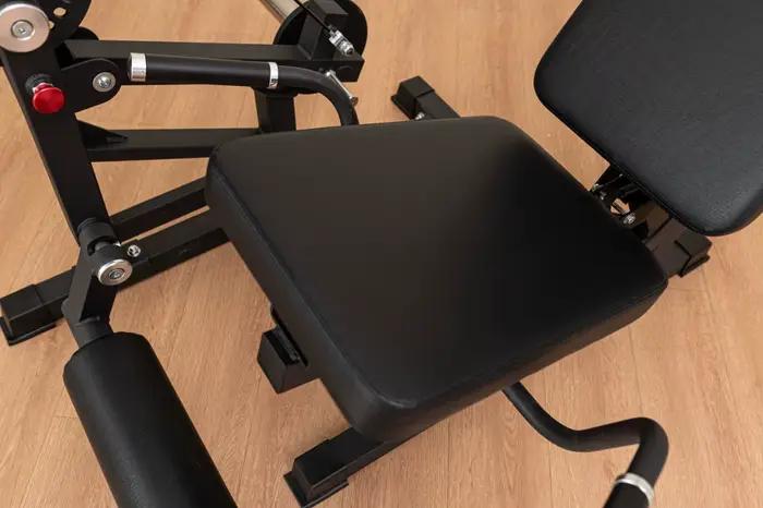 Appareil de musculation combiné pour extensions et curls assis à charge libre